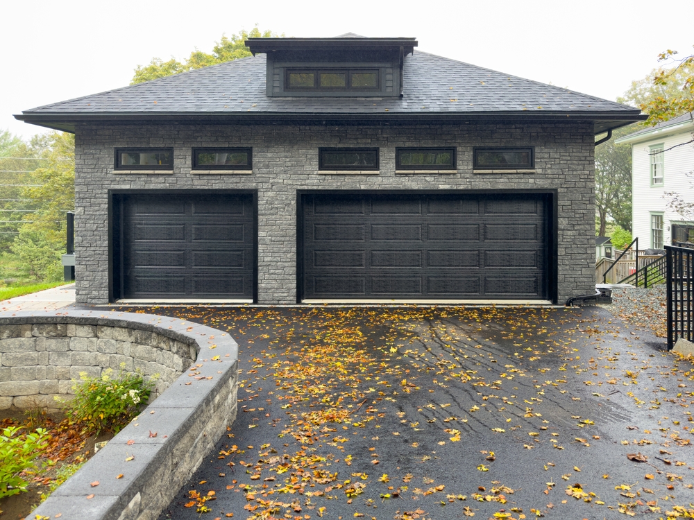 A,double,and,single Width,black,metal,garage,door,with,panels