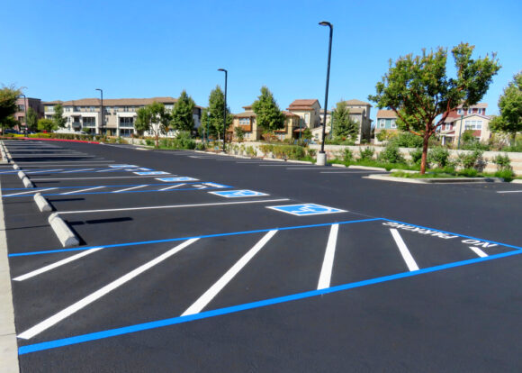 Freshly,resurfaced,and,repainted,handicap,parking,space,in,a,parking